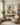 Arms of Mercy Christian wall art by Gabriel Heaton in a natural wood float frame above a console in a warm neutral reading room