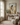 Arms of Mercy Christian wall art by Gabriel Heaton in a natural wood float frame above a console in a warm neutral reading room with soft natural light