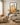 Come Follow Me Christian wall art by Gabriel Heaton in a black float frame above a console in a warm neutral living room
