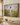 The Handiwork of God gold float framed canvas above a warm wood shelf