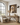 He Is Risen Christian wall art by Gabriel Heaton in a natural wood float frame in a bright farmhouse-style room with an arched window