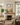 Peace in Christ Christian wall art by Gabriel Heaton in a black frame above a fireplace in a warm neutral living room
