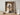 Gabriel Heaton painting of Jesus Christ in white robes standing in the doorway of the empty tomb looking out into bright light beyond the stone archway